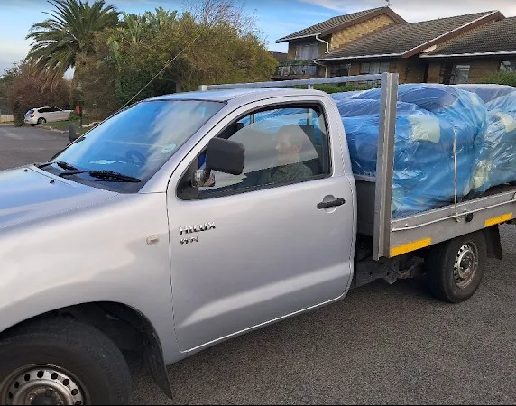 FTH Transport moving truck on a tree-lined street in Thornton, Cape Town